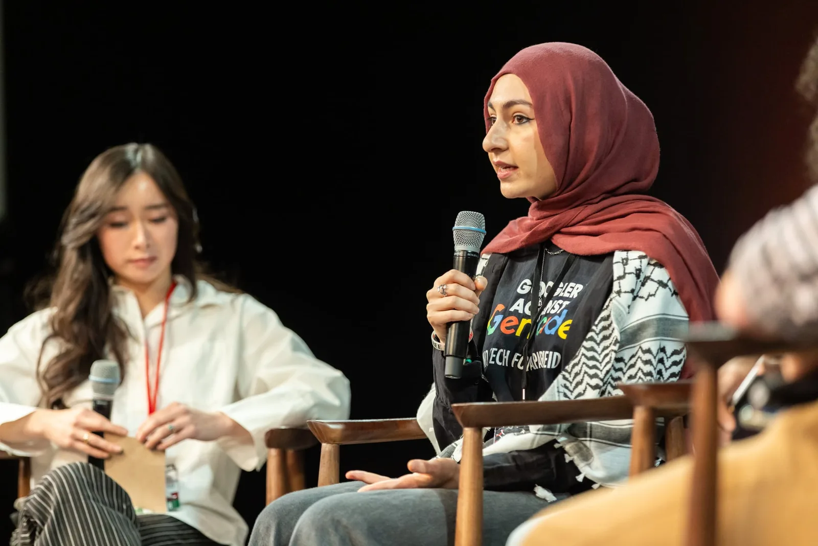 A speaker addressing the audience during a Tech for Palestine panel discussion
